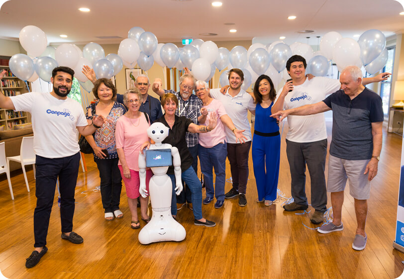 The Conpago team celebrating with residents at a community event